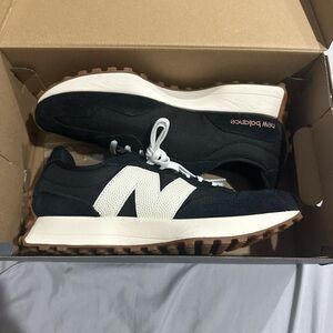 New Balance women’s Black and White Sneakers